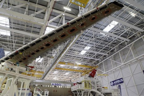 A wing and main body section of the first Airbus A350 is seen on the final assembly line in Toulouse, southwestern France, October 23,2012. A wing and main body section of the first Airbus A350 is seen on the final assembly line in Toulouse, southwestern France, October 23,2012.