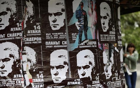 A woman walks past election posters of Volen Siderov, leader of the Attack party, in Sofia May 13, 2013. REUTERS/Stoyan Nenov A woman walks past election posters of Volen Siderov, leader of the Attack party, in Sofia May 13, 2013. REUTERS/Stoyan Nenov