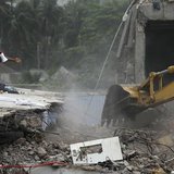 Rescue workers attempt to find survivors from the rubble of the collapsed Rana Plaza building in Savar, around 30 km (19 miles) outside Dhak
