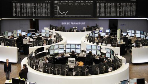 Traders work at their desks in front of the DAX board at the Frankfurt stock exchange May 14, 2013. REUTERS/Remote/Lizza David Traders work at their desks in front of the DAX board at the Frankfurt stock exchange May 14, 2013. REUTERS/Remote/Lizza David