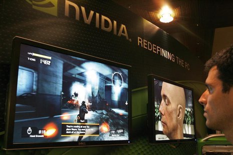 A sales man demonstrates a computer game in a display area of Nvidia Corp. during the second day of the annual 2007 Computex Taipei June 6, A sales man demonstrates a computer game in a display area of Nvidia Corp. during the second day of the annual 2007 Computex Taipei June 6,