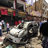 People gather at the scene of a car bomb explosion outside a hospital in Benghazi May 13, 2013. REUTERS/Esam Al-Fetori People gather at the scene of a car bomb explosion outside a hospital in Benghazi May 13, 2013. REUTERS/Esam Al-Fetori