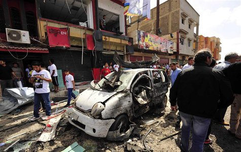 People gather at the scene of a car bomb explosion outside a hospital in Benghazi May 13, 2013. REUTERS/Esam Al-Fetori People gather at the scene of a car bomb explosion outside a hospital in Benghazi May 13, 2013. REUTERS/Esam Al-Fetori