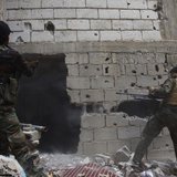 Free Syrian Army fighters return fire after what they say was during clashes with forces loyal to President Bashar al-Assad in Deir al-Zor M Free Syrian Army fighters return fire after what they say was during clashes with forces loyal to President Bashar al-Assad in Deir al-Zor M