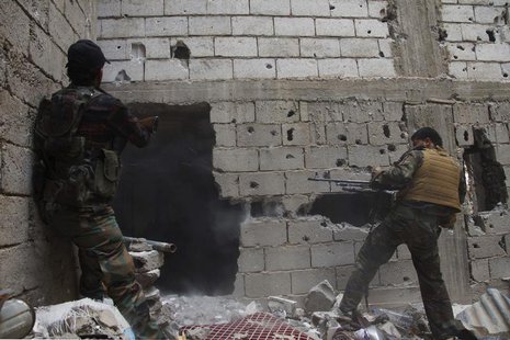 Free Syrian Army fighters return fire after what they say was during clashes with forces loyal to President Bashar al-Assad in Deir al-Zor M Free Syrian Army fighters return fire after what they say was during clashes with forces loyal to President Bashar al-Assad in Deir al-Zor M
