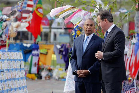 British Prime Minister David Cameron (R) visits a memorial to the victims of the Boston Marathon bombings in Copley Square with Massachusett British Prime Minister David Cameron (R) visits a memorial to the victims of the Boston Marathon bombings in Copley Square with Massachusett