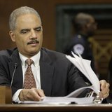 U.S. Attorney General Eric Holder refers to his notes during testimony before the Senate Judiciary Committee on Capitol Hill in Washington, U.S. Attorney General Eric Holder refers to his notes during testimony before the Senate Judiciary Committee on Capitol Hill in Washington,