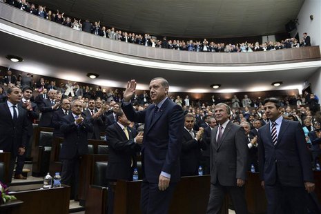 Turkey's Prime Minister Tayyip Erdogan (C) greets members of parliament from his ruling AK Party (AKP) during a meeting at the Turkish parli Turkey's Prime Minister Tayyip Erdogan (C) greets members of parliament from his ruling AK Party (AKP) during a meeting at the Turkish parli