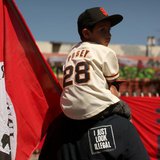 Dominic Ibarra sits on the shoulders of his grandfather Luis Ibarra during an immigration rally on May Day in the Mission District in San Fr Dominic Ibarra sits on the shoulders of his grandfather Luis Ibarra during an immigration rally on May Day in the Mission District in San Fr