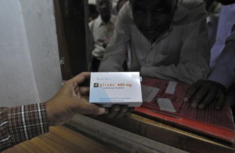 A man buys cancer drug Glivec for a relative who is suffering from cancer at a pharmacy in a government-run hospital in the western Indian c A man buys cancer drug Glivec for a relative who is suffering from cancer at a pharmacy in a government-run hospital in the western Indian c