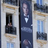 Posters for the film 'The Great Gatsby' showing actor Leonardo DiCaprio (C) and actress Carey Mulligan (R) are displayed outside the Carlton