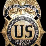 DEA Badge (courtesy of Wikimedia Commons).