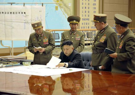 North Korean leader Kim Jong-un (C) presides over an urgent operation meeting on the Korean People's Army Strategic Rocket Force's performan North Korean leader Kim Jong-un (C) presides over an urgent operation meeting on the Korean People's Army Strategic Rocket Force's performan