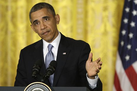 President Barack Obama pauses as he responds to a question during a news conference with Britain's Prime Minister David Cameron in the East President Barack Obama pauses as he responds to a question during a news conference with Britain's Prime Minister David Cameron in the East