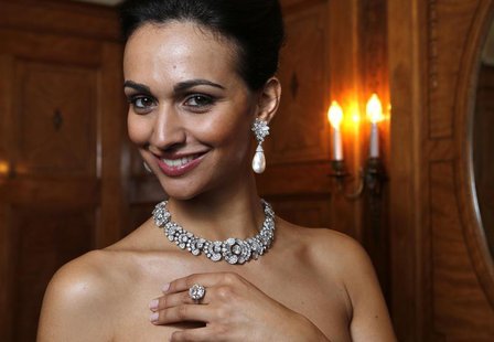 A model wears a diamond necklace/bracelet by Bulgari (1954) a natural pearl and diamond pendant earrings(1962) and a diamond ring (1962) dur A model wears a diamond necklace/bracelet by Bulgari (1954) a natural pearl and diamond pendant earrings(1962) and a diamond ring (1962) dur