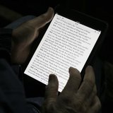 A man reads the bible from an iPad mini at the "Christ is the Answer International Ministries" group's camp near Florence February 2, 2013. A man reads the bible from an iPad mini at the "Christ is the Answer International Ministries" group's camp near Florence February 2, 2013.