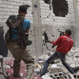 Free Syrian Army fighters return fire after what they say was during clashes with forces loyal to President Bashar al-Assad in Deir al-Zor M Free Syrian Army fighters return fire after what they say was during clashes with forces loyal to President Bashar al-Assad in Deir al-Zor M