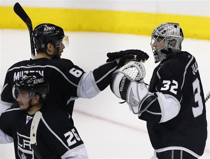 Los Angeles Kings goalie Jonathan Quick (32) celebrates defeating the San Jose Sharks with teammate Los Angeles Kings defenseman Jake Muzzin Los Angeles Kings goalie Jonathan Quick (32) celebrates defeating the San Jose Sharks with teammate Los Angeles Kings defenseman Jake Muzzin
