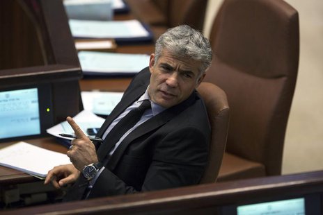 Israel's Finance Minister Yair Lapid gestures as he attends the opening of the summer session of the Knesset, the Israeli parliament, in Jer Israel's Finance Minister Yair Lapid gestures as he attends the opening of the summer session of the Knesset, the Israeli parliament, in Jer