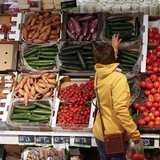 A woman checks vegetables at the Biocompany organic supermarket in Berlin, January 31, 2013. REUTERS/Fabrizio Bensch