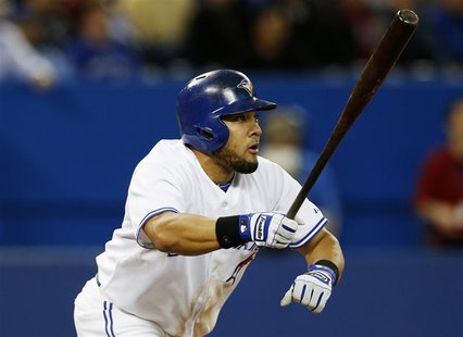 Toronto Blue Jays' Melky Cabrera follows through on a RBI double against the San Francisco Giants during the seventh inning of their MLB Ame Toronto Blue Jays' Melky Cabrera follows through on a RBI double against the San Francisco Giants during the seventh inning of their MLB Ame