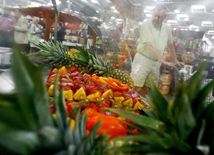 A customer shops along the fruits department in a Sam's Club store, a division of Wal-Mart Stores, in Bentonville, Arkansas June 2, 2011. RE A customer shops along the fruits department in a Sam's Club store, a division of Wal-Mart Stores, in Bentonville, Arkansas June 2, 2011. RE