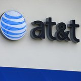 The AT&T logo is pictured by its store in Carlsbad, California, April 22, 2013. REUTERS/Mike Blake The AT&T logo is pictured by its store in Carlsbad, California, April 22, 2013. REUTERS/Mike Blake