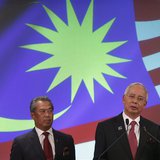 Malaysia's Prime Minister Najib Razak (R) speaks as his deputy Muhyiddin Yassin listens during the announcement of the new cabinet ministers Malaysia's Prime Minister Najib Razak (R) speaks as his deputy Muhyiddin Yassin listens during the announcement of the new cabinet ministers