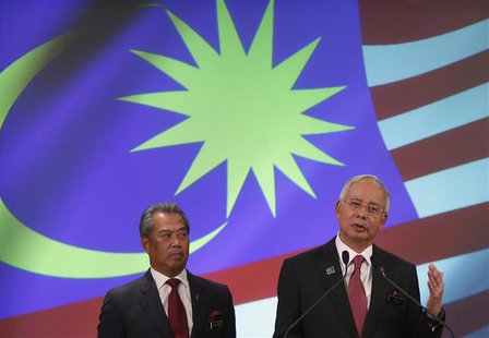 Malaysia's Prime Minister Najib Razak (R) speaks as his deputy Muhyiddin Yassin listens during the announcement of the new cabinet ministers Malaysia's Prime Minister Najib Razak (R) speaks as his deputy Muhyiddin Yassin listens during the announcement of the new cabinet ministers