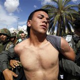 A Palestinian man is taken away by Israeli border policemen during clashes near Damascus Gate at Jerusalem's old city May 15, 2013. REUTERS/ A Palestinian man is taken away by Israeli border policemen during clashes near Damascus Gate at Jerusalem's old city May 15, 2013. REUTERS/