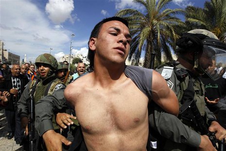 A Palestinian man is taken away by Israeli border policemen during clashes near Damascus Gate at Jerusalem's old city May 15, 2013. REUTERS/ A Palestinian man is taken away by Israeli border policemen during clashes near Damascus Gate at Jerusalem's old city May 15, 2013. REUTERS/