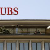 People stand on a terrace of an office building of Swiss bank UBS at the Paradeplatz square in Zurich April 18, 2013. REUTERS/Arnd Wiegmann
