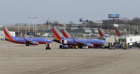 Several Souhtwest Airlines planes are lined up at Terminal two at the Lambert - St. Louis International Airport, in St. Louis, Missouri, Mar Several Souhtwest Airlines planes are lined up at Terminal two at the Lambert - St. Louis International Airport, in St. Louis, Missouri, Mar