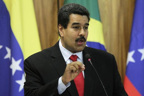 Venezuela's President Nicolas Maduro delivers a statement to the media with Brazil's President Dilma Rousseff at the Planalto Palace in Bras Venezuela's President Nicolas Maduro delivers a statement to the media with Brazil's President Dilma Rousseff at the Planalto Palace in Bras