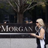 A woman walks past JP Morgan Chase's international headquarters on Park Avenue in New York July 13, 2012. REUTERS/Andrew Burton A woman walks past JP Morgan Chase's international headquarters on Park Avenue in New York July 13, 2012. REUTERS/Andrew Burton