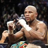 Undefeated WBC welterweight champion Floyd Mayweather Jr. of the U.S. celebrates his victory over Robert Guerrero, also of the U.S., at the Undefeated WBC welterweight champion Floyd Mayweather Jr. of the U.S. celebrates his victory over Robert Guerrero, also of the U.S., at the