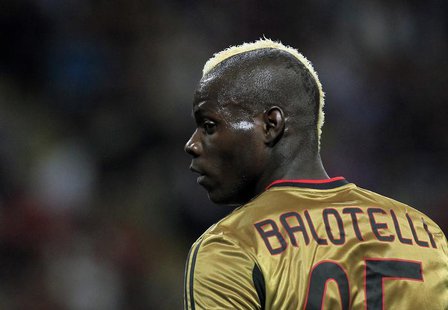 AC Milan's Mario Balotelli looks on during their Italian Serie A soccer match against AS Roma at the San Siro stadium in Milan May 12, 2013. AC Milan's Mario Balotelli looks on during their Italian Serie A soccer match against AS Roma at the San Siro stadium in Milan May 12, 2013.