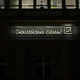 The logo of Germany's largest business bank, Deutsche Bank, is illuminated at the bank's original headquarters in Frankfurt January 31, 2012 The logo of Germany's largest business bank, Deutsche Bank, is illuminated at the bank's original headquarters in Frankfurt January 31, 2012