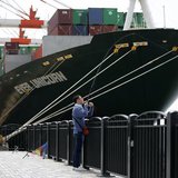 A man fishes near a cargo ship at a port in Tokyo April 18, 2013. REUTERS/Issei Kato A man fishes near a cargo ship at a port in Tokyo April 18, 2013. REUTERS/Issei Kato
