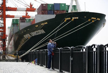 A man fishes near a cargo ship at a port in Tokyo April 18, 2013. REUTERS/Issei Kato A man fishes near a cargo ship at a port in Tokyo April 18, 2013. REUTERS/Issei Kato
