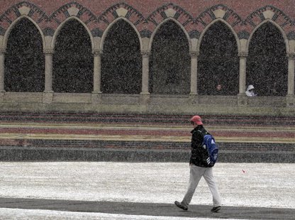 A pedestrian walks through a late winter snow storm outside Harvard University in Cambridge, Massachusetts February 29, 2012. REUTERS/Brian A pedestrian walks through a late winter snow storm outside Harvard University in Cambridge, Massachusetts February 29, 2012. REUTERS/Brian