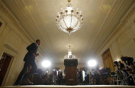 President Barack Obama takes the stage to deliver a statement in the East Room of the White House in Washington, May 15, 2013. REUTERS/Kevin President Barack Obama takes the stage to deliver a statement in the East Room of the White House in Washington, May 15, 2013. REUTERS/Kevin
