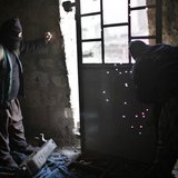 Fighters from Islamist Syrian rebel group Jabhat al-Nusra watch snipers on the front line during a fight with Syria forces loyal to Presiden Fighters from Islamist Syrian rebel group Jabhat al-Nusra watch snipers on the front line during a fight with Syria forces loyal to Presiden