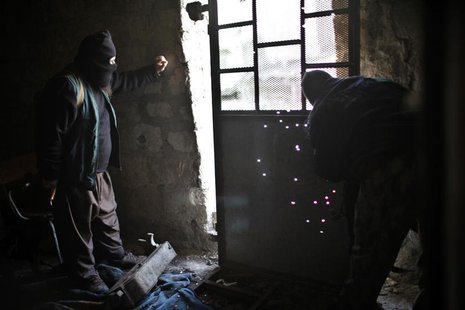 Fighters from Islamist Syrian rebel group Jabhat al-Nusra watch snipers on the front line during a fight with Syria forces loyal to Presiden Fighters from Islamist Syrian rebel group Jabhat al-Nusra watch snipers on the front line during a fight with Syria forces loyal to Presiden