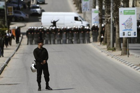 Palestinian police officers block the road to prevent Palestinian demonstrators from marching towards the Jewish settlement of Beit El March Palestinian police officers block the road to prevent Palestinian demonstrators from marching towards the Jewish settlement of Beit El March