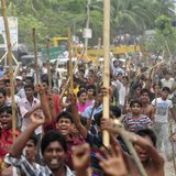 Garment workers shout slogans as they block a street during a protest to demand capital punishment for those responsible for the collapse of Garment workers shout slogans as they block a street during a protest to demand capital punishment for those responsible for the collapse of