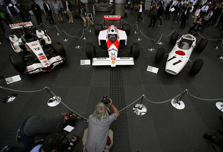(L-R) The 2006 Honda RA106, 1988 McLaren Honda MP4/4 and 1965 Honda RA272 Formula One cars are displayed at the company headquarters in Toky (L-R) The 2006 Honda RA106, 1988 McLaren Honda MP4/4 and 1965 Honda RA272 Formula One cars are displayed at the company headquarters in Toky