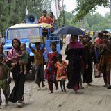 People carry their belongings as they move to a shelter as cyclone Mahasen approaches, in Cox's Bazar May 15, 2013. REUTERS/Stringer People carry their belongings as they move to a shelter as cyclone Mahasen approaches, in Cox's Bazar May 15, 2013. REUTERS/Stringer