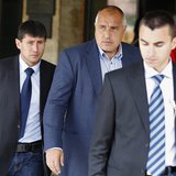 The leader of Bulgarian centre-right GERB party Boiko Borisov (C) walks out of his party's headquarters surrounded by bodyguards in Sofia Ma The leader of Bulgarian centre-right GERB party Boiko Borisov (C) walks out of his party's headquarters surrounded by bodyguards in Sofia Ma