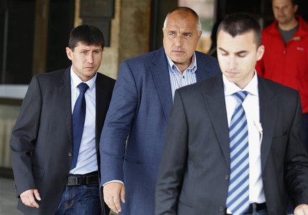 The leader of Bulgarian centre-right GERB party Boiko Borisov (C) walks out of his party's headquarters surrounded by bodyguards in Sofia Ma The leader of Bulgarian centre-right GERB party Boiko Borisov (C) walks out of his party's headquarters surrounded by bodyguards in Sofia Ma